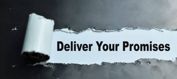 Concept of Deliver Your Promises Text written in torn paper.