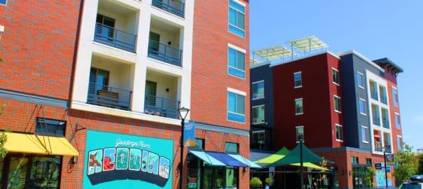 August 26, 2023 in Redding, CA: Modern high rise condos taken in downtown Redding, CA where the downtown district is being revitalized with a neighborhood with restaurants and a renovated theater -- Shutterstock.
