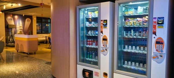 Vending machine in a hotel lobby. KUALA LUMPUR, MALAYSIA - CIRCA JANUARY, 2020: interior shot of Holiday Inn Express in Kuala Lumpur.