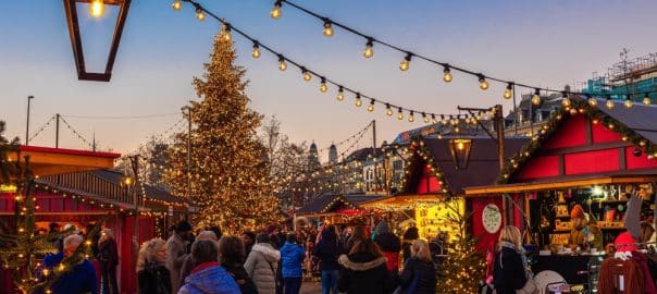 Zurich, Switzerland - November 23, 2023: Christmas market in front of the opera house at the Sechselautenplatz square-Bellevue in Zurich at sunset