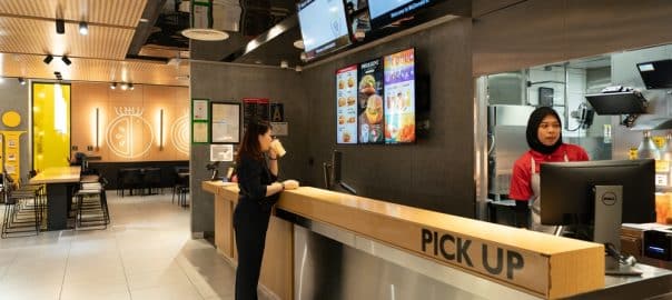 KUALA LUMPUR, MALAYSIA - DECEMBER 01, 2023: the service counter at a McDonald's restaurant. McDonald's is a global fast-food chain known for its burgers, fries, and other quick-service meals.