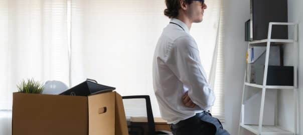 Lay off workers. Sad fired Businessman feeling stress after losing his job in the office.