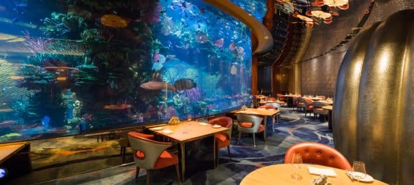 Dubai, UAE - FEBRUARY 18, 2018: Al Mahara luxury Burj Al Arab restaurant. Interior of Burj Al Arab famous Dubai hotel. 7 star luxury hotel. Iconic the most luxurious restaurant and hotel in the world.