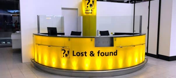 Schiphol, the Netherlands - Januari 5, 2019: Yellow lost and found counter at Amsterdam Airport Schiphol.