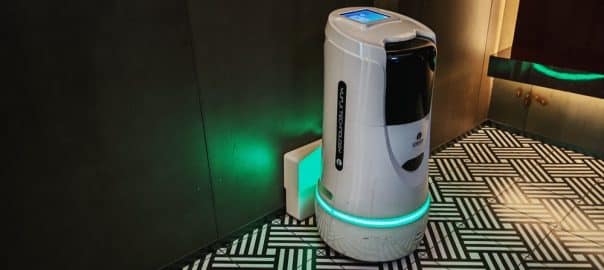 shenzhen, china - February 13, 2025 : White robot provides delivery service at a hotel in Shenzhen, China. Modern service robot for hotel guest delivery solutions.
