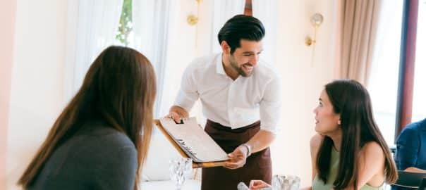 Engaging Service at the Eatery, Clients Enjoying Conversations while Waitstaff Attend, Cafe Scene Filled with Delicious Food and Beverages, Where Lifestyle Meets Business in Comfortable Dining.