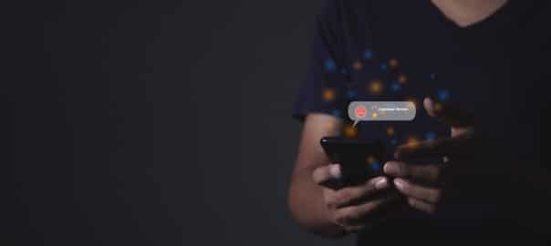 Customer Review, Young man hand holding smartphone to review and gives 1 star, with poor service results, Bad review Rated just 1 star Feedback options.