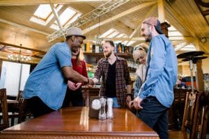 Leisure,,People,And,Holidays,Concept,-,Group,Of,Five,Young leisure, people and holidays concept - group of five young multiracial smiling friends having a meeting in cafe.